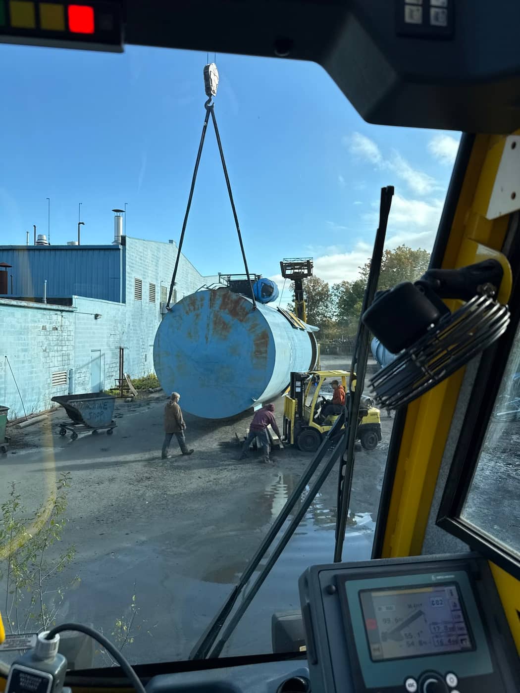 Canal Crane crew and forklift setting a large industrial vessel at a plant