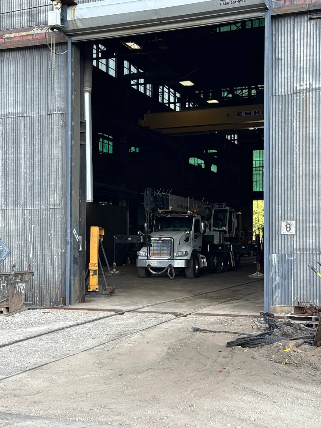 Canal Crane rigging crew securing a steel load